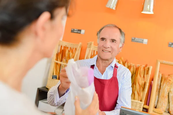 Local bakeshop and man — Stock Photo, Image