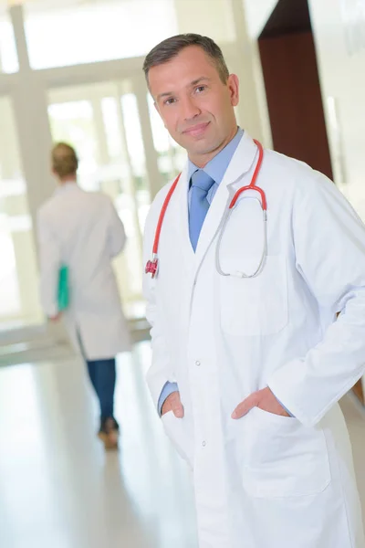 Doctor posing in the hallway — Stock Photo, Image