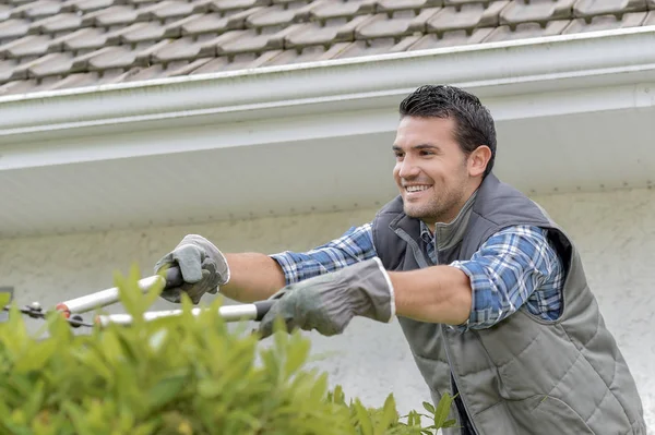 Tuinman en actie bijstand — Stockfoto