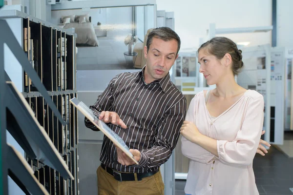 Manager showing finishing to a coworker — Stock Photo, Image