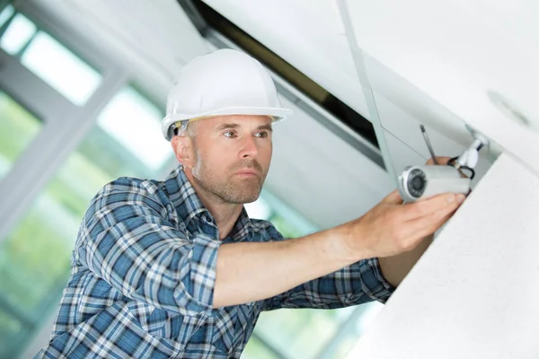 Middle-age contractor working and helmet — Stock Photo, Image