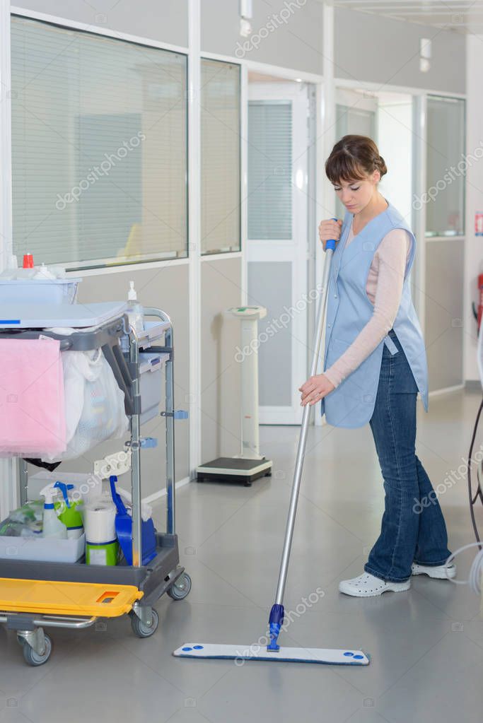 Floor care cleaning services with washing mop in clean hospital — Stock