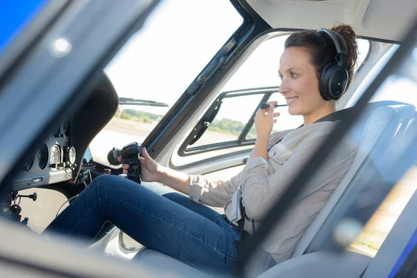 Portrait of young beautiful woman pilot in a airplane — Stock Photo, Image