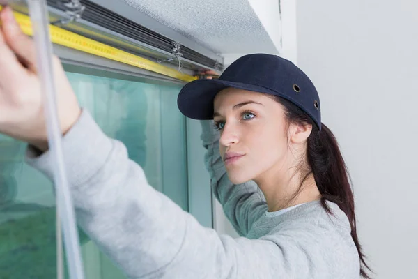 Measuring a window and work — Stock Photo, Image