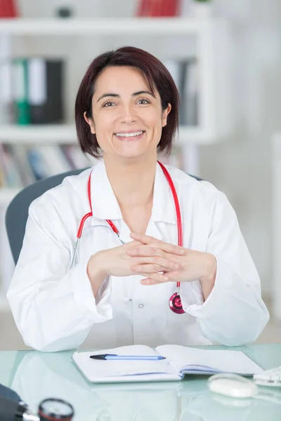 Portrait of young female doctor in her office — Stock Photo, Image