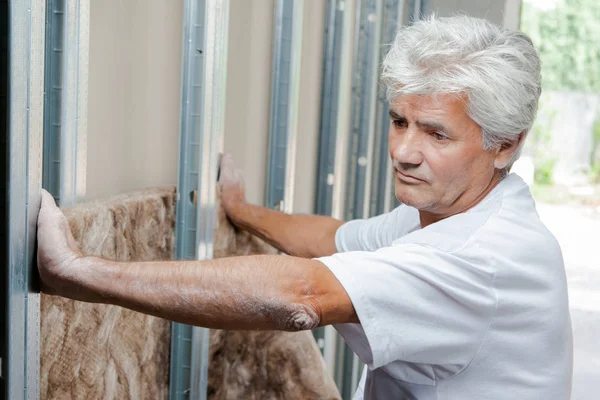 stock image Mason fitting wall insulation