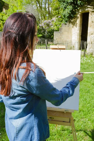 Painter in shirt painting — Stock Photo, Image