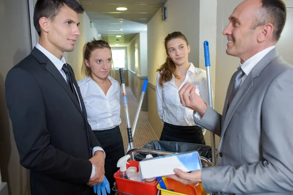 Cleaning team with manager — Stock Photo, Image