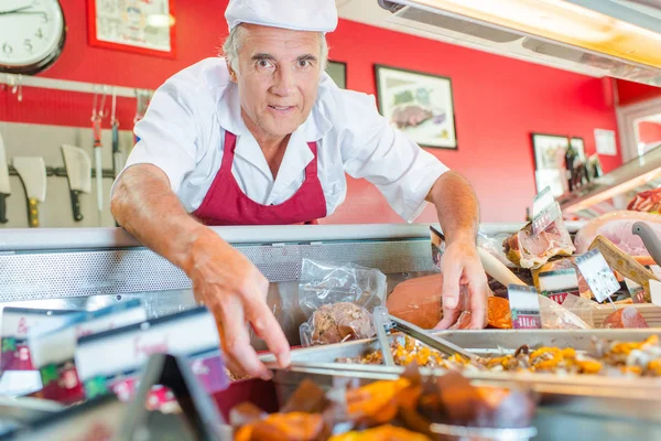 Arranging the display and man — Stock Photo, Image