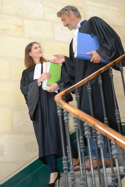 Judges descending staircase and judge — Stock Photo, Image
