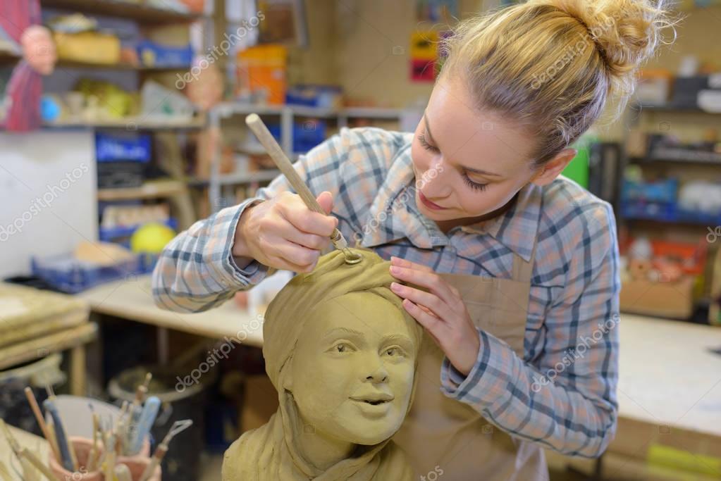 Female sculptor at work — Stock Photo © photography33 134469454
