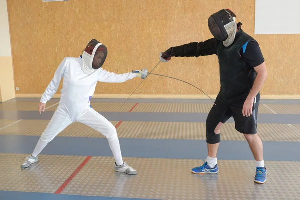 Two people in fencing competition — Stock Photo, Image