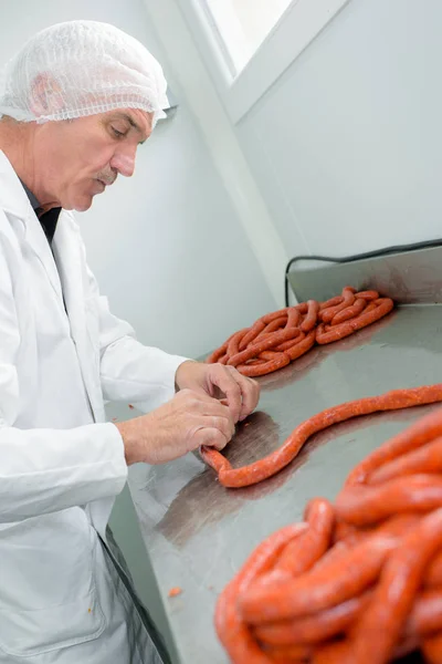 Meat packer making sausages — Stock Image Meat packer making sausages Stock Picture