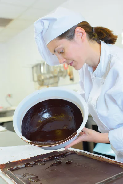 Chef pouring melted chocolate — Stock Photo, Image