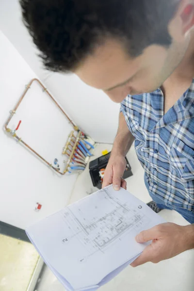 Man looking at sketches — Stock Photo, Image