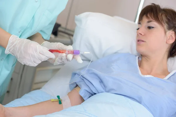 Patient s blood extraction and inject — Stock Photo, Image