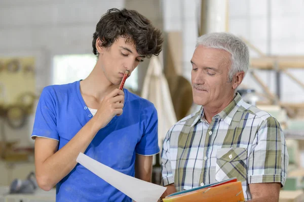 Pensive carpenters and architect — Stock Photo, Image