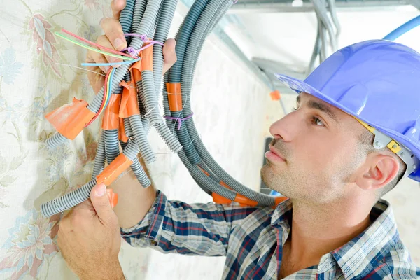 Electrician and blue  bundle — Stock Photo, Image