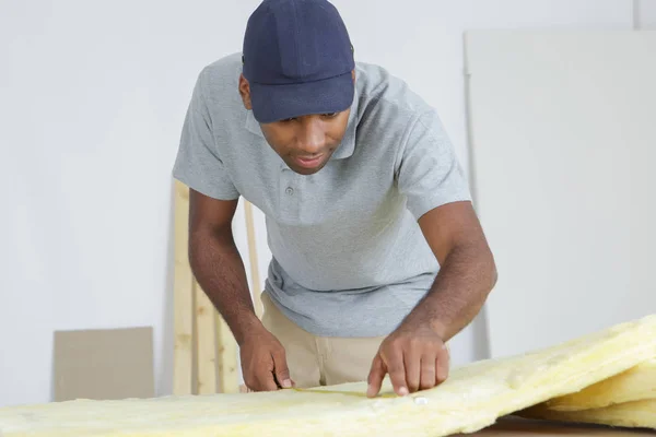 Workman measuring materials and workman — Stock Photo, Image