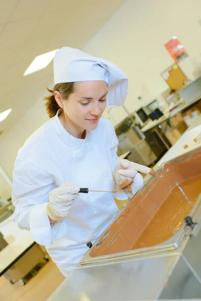 Chef with vat of toffee — Stock Photo, Image