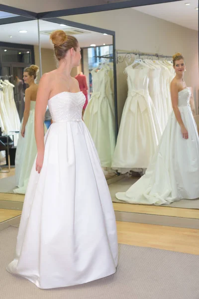 Bride having a final fitting — Stock Photo, Image