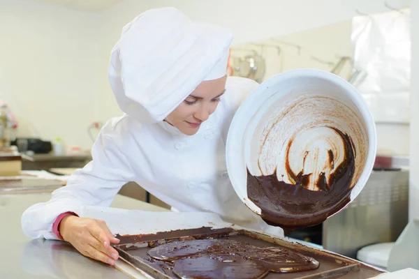 Pouring chocolate to bake — Stock Photo, Image