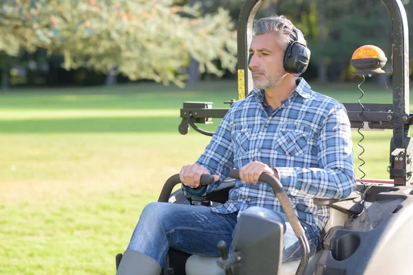 Mowing a big area Royalty Free Stock Photos
