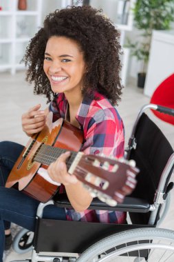 Disabled lady playing guitar clipart
