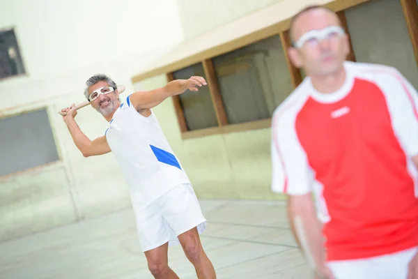 Men playing pala and player — Stock Photo, Image