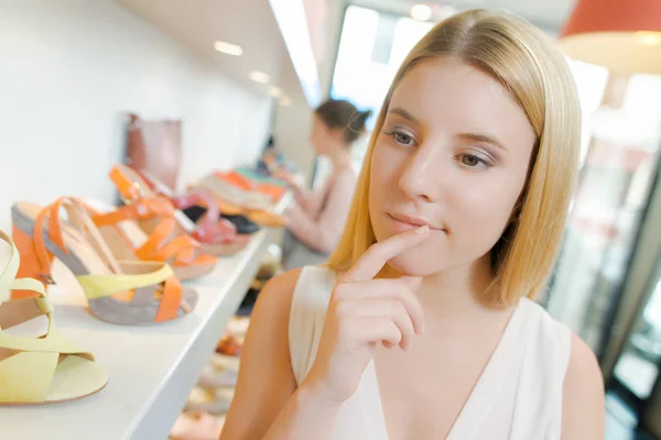 Trying to choose shoes — Stock Photo, Image