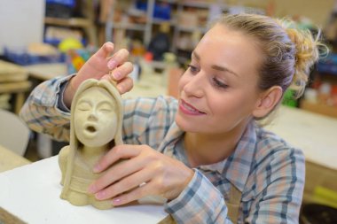 Woman sculpting and sculpture clipart