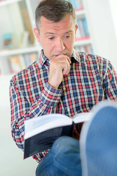 Man reading interesting book — Stock Photo, Image