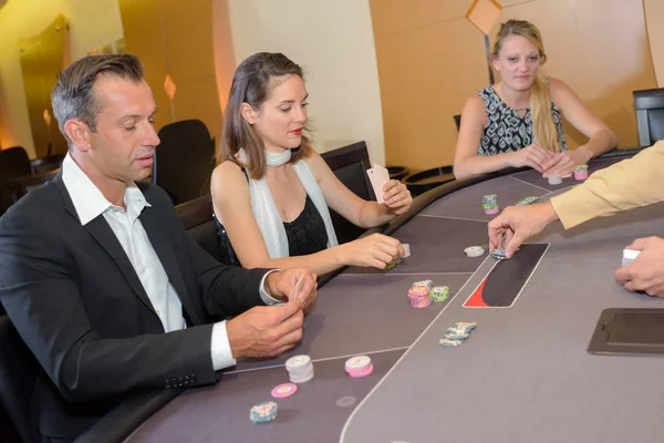 People around casino table — Stock Photo, Image