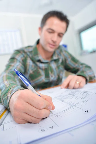 Taking time to edit blue prints — Stock Photo, Image