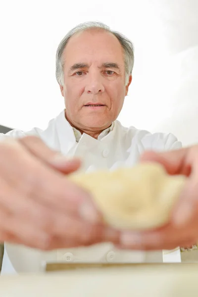 Baker making pastry and old — Stock Photo, Image
