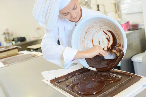 Pouring chocolate into the mould — Stock Photo, Image