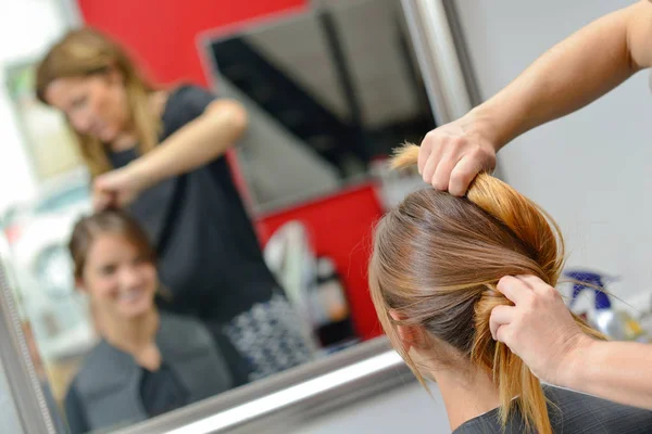 Getting her hair done