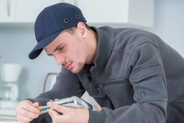 De losse kraan en werk — Stockfoto