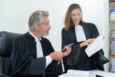 judges reading law book clipart