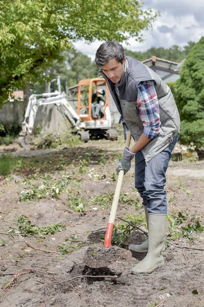 Trädgårdsmästare plantering och stövlar — Stockfoto