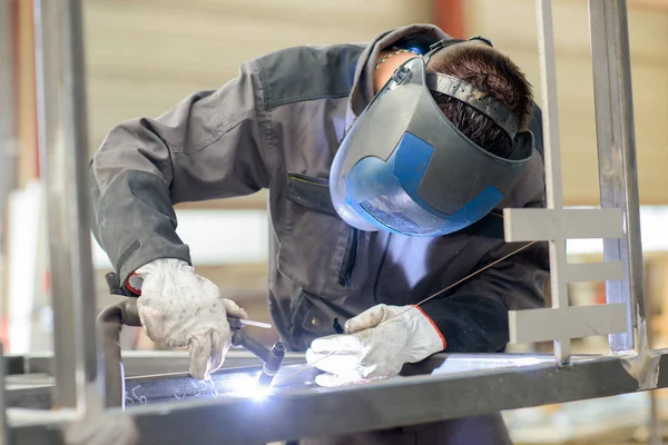 Welder at work and man — Stock Photo, Image
