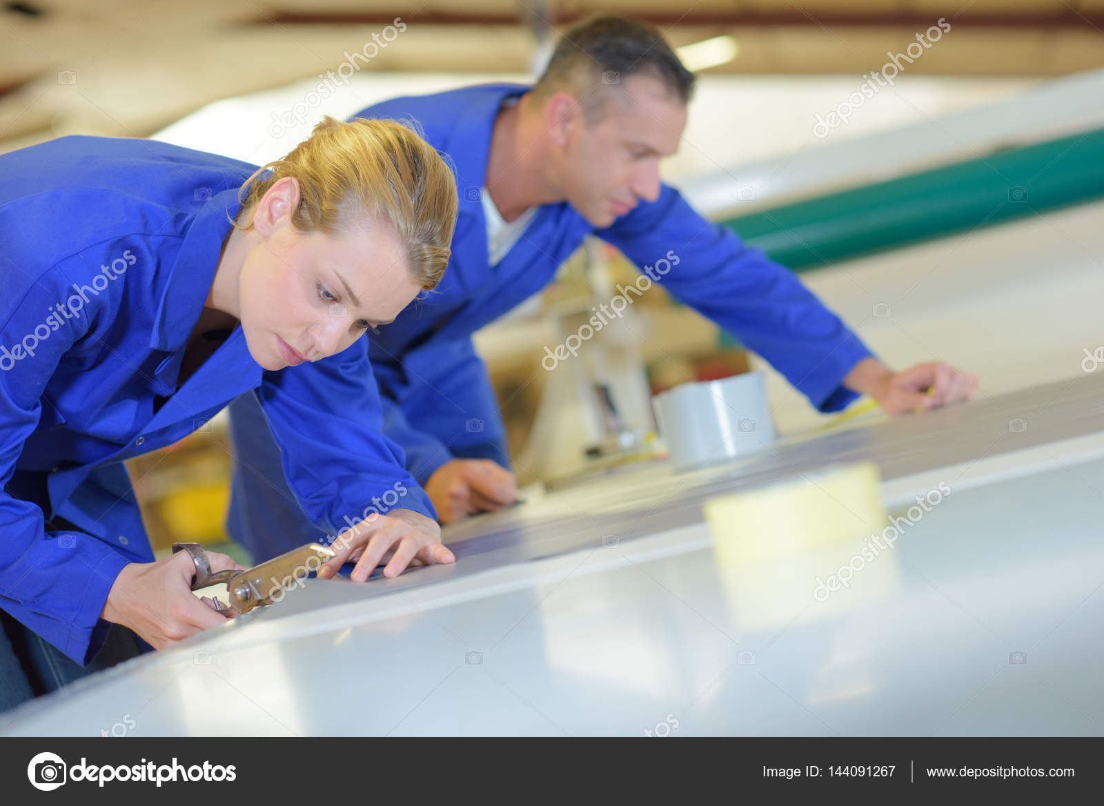 Employees cutting canvas and warehouse — Stock Photo © photography33