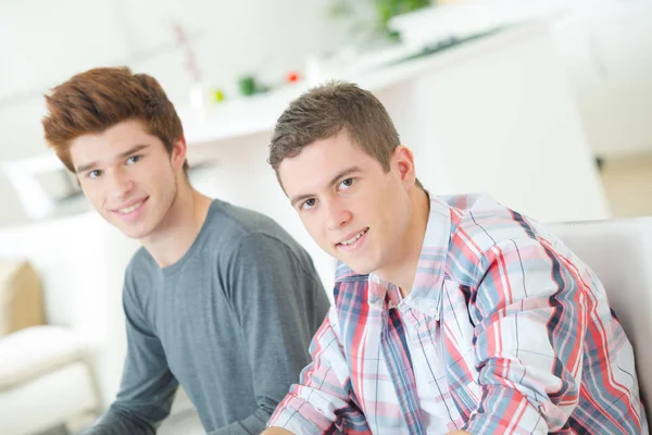 Two guys chilling on the sofa — Stock Photo, Image