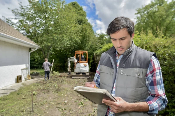 Arbetsledare anläggning papper och penna — Stockfoto