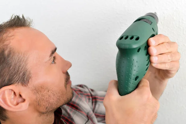 Drilling into the wall — Stock Photo, Image