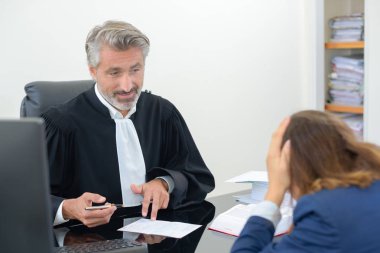 Client with head in hands talking to lawyer clipart