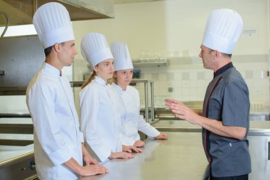 Chef talking to trainees clipart