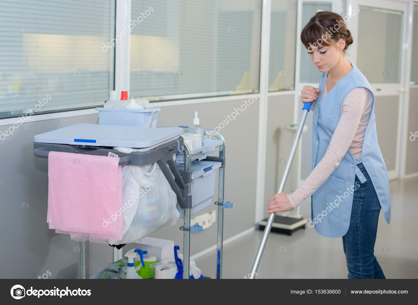 Janitress mopping the hallway — Stock Photo © photography33 153636600