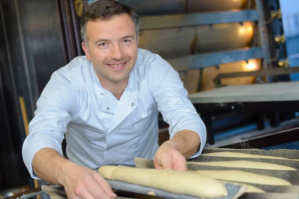 Preparing the baguette and chef — Stock Photo, Image