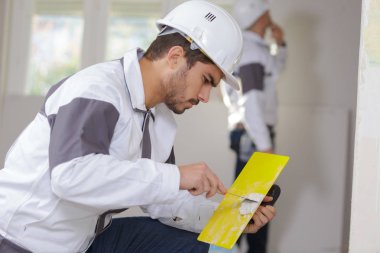 builder preparing a trowel clipart